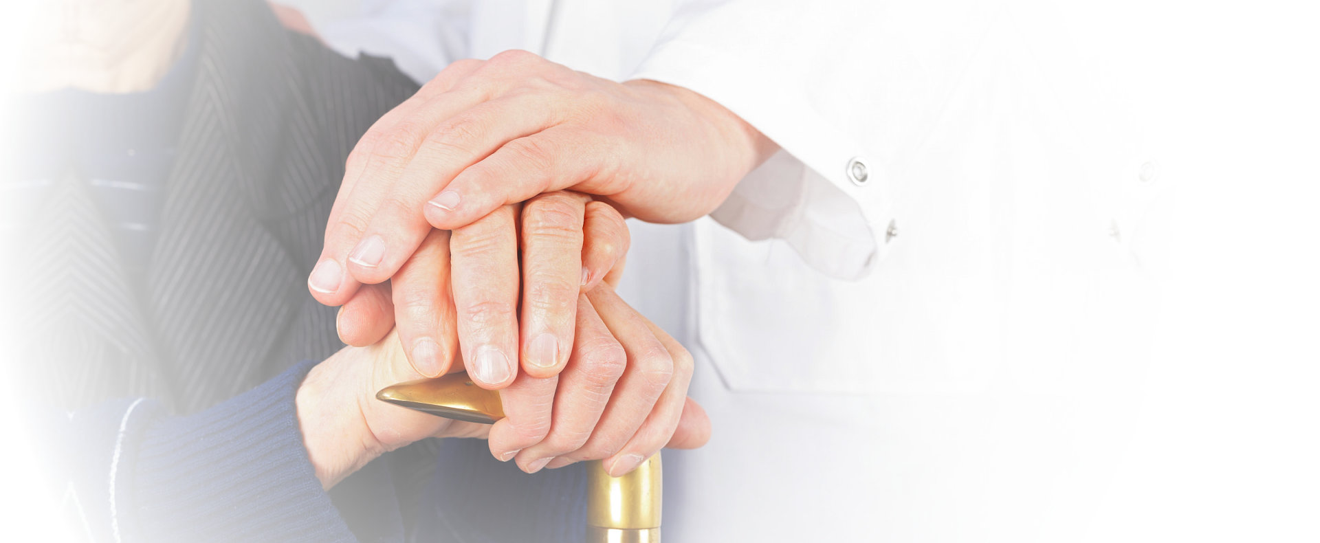 Elder and caregiver hand in hand
