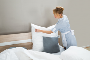 girl cleaning bedsheets